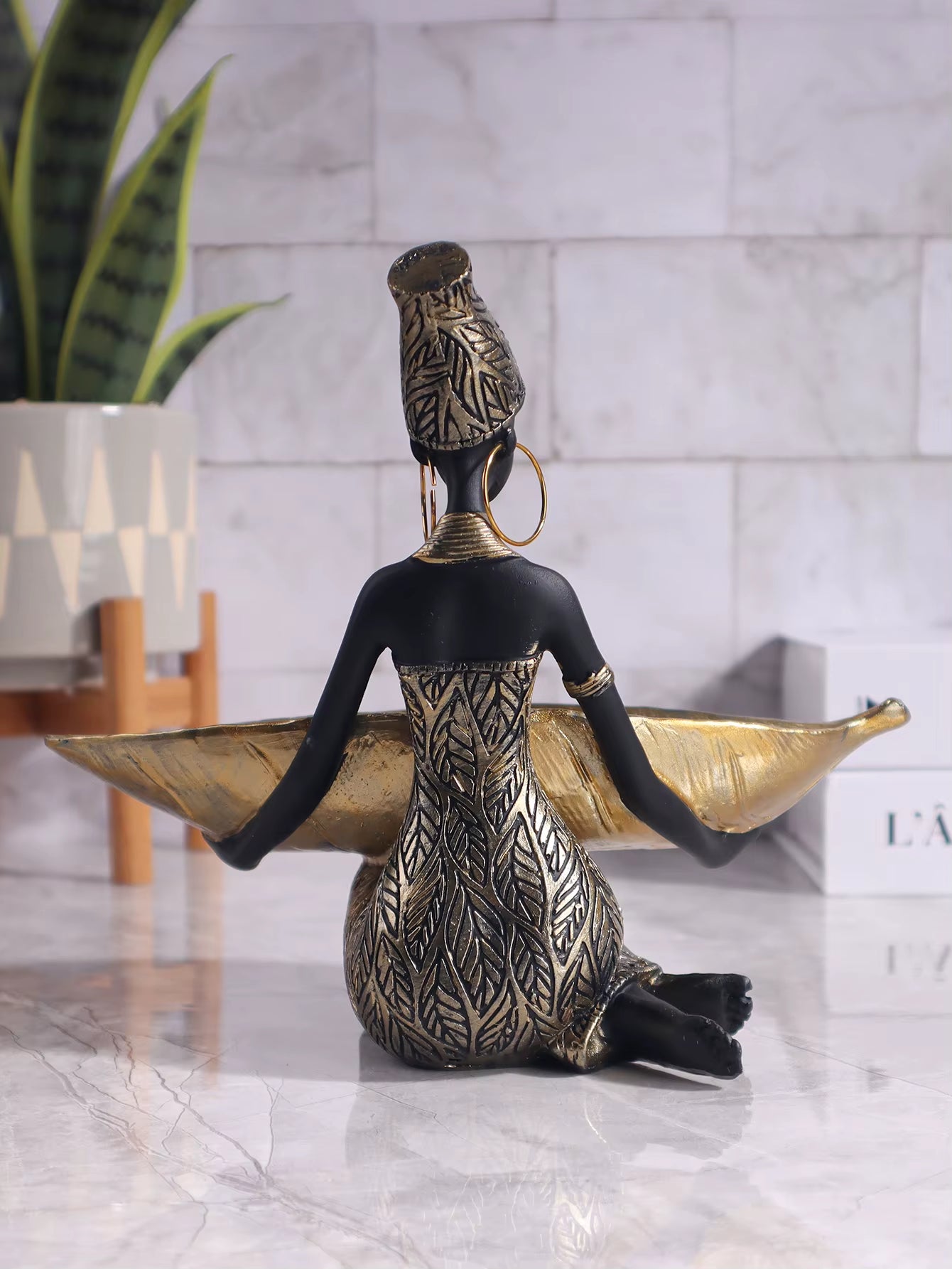 African Girl Holding a Plate Sculpture