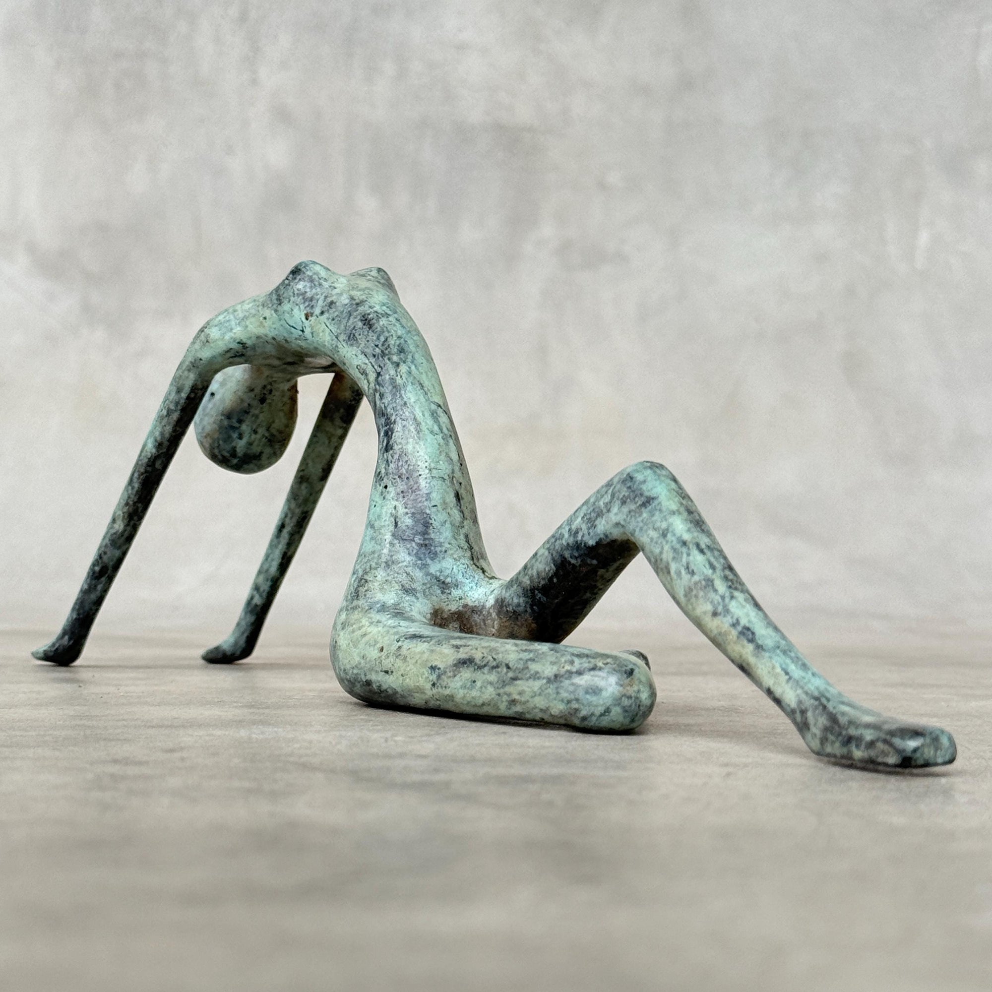 Stretching Lady Bronze Sculpture